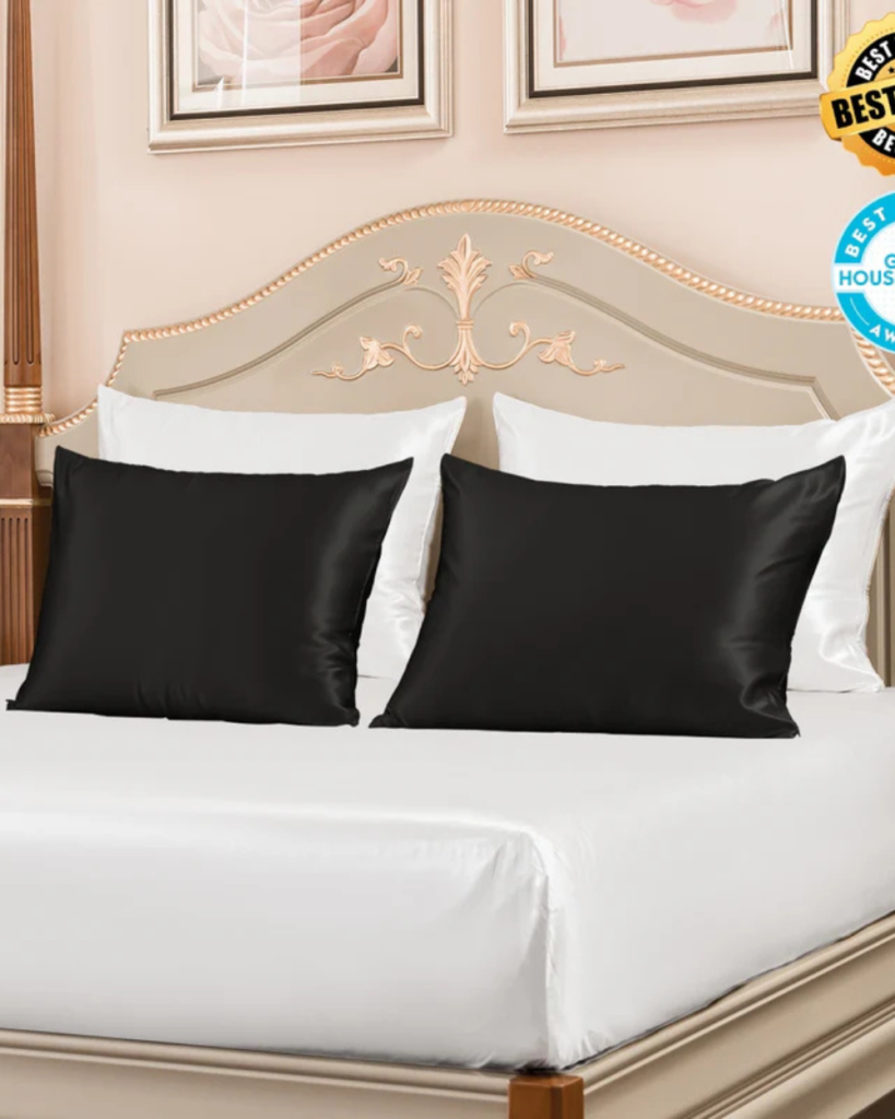 Pair of black cooling pillows styled on a cozy bedroom bed for restful sleep
