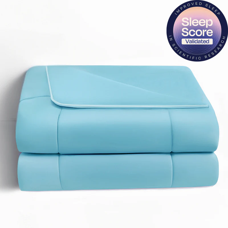 Promeed lightweight comforter in soft blue layered for a cozy bedroom look