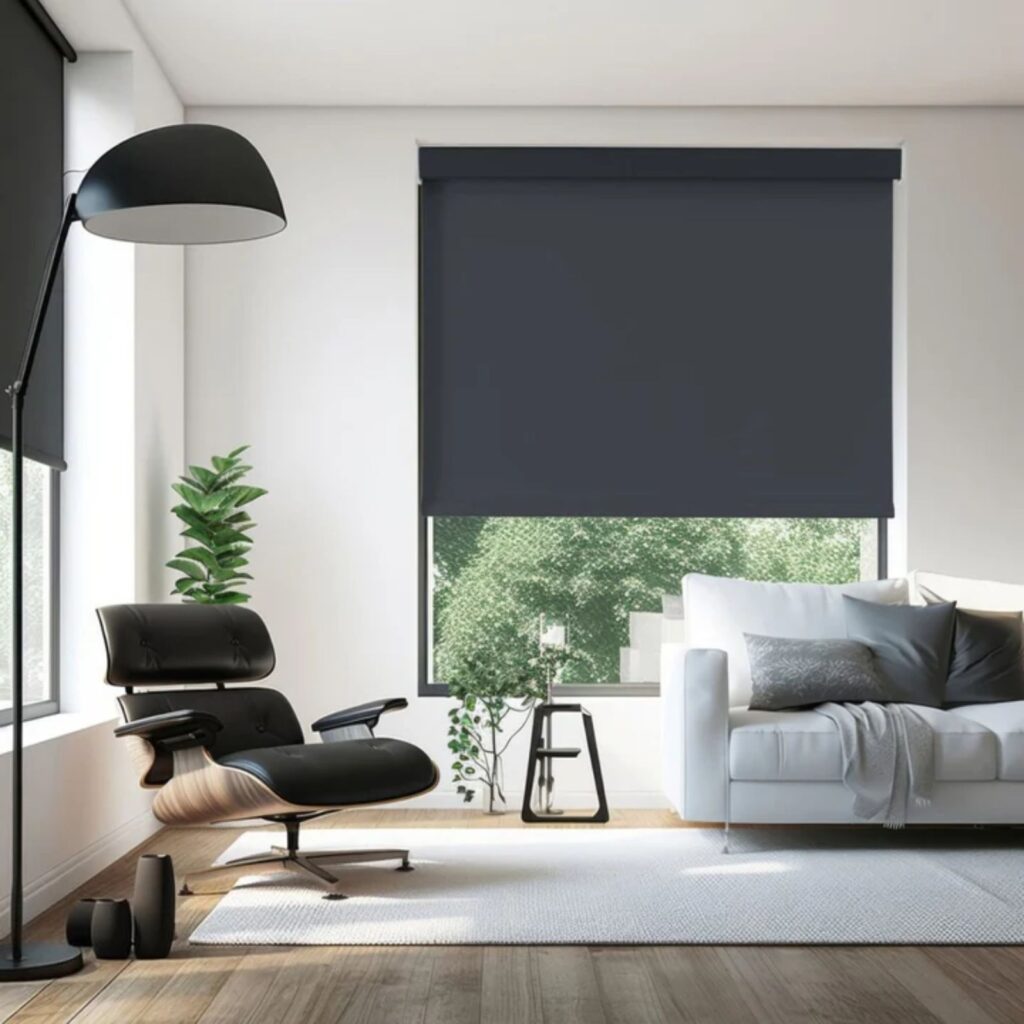 Dark gray blackout roller shade installed in a modern living room window.
