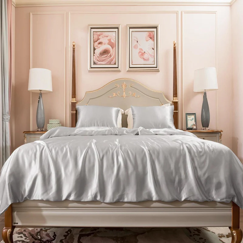 Cozy bedding ideas featuring layered sheets, comforter, and pillows in a warm bedroom