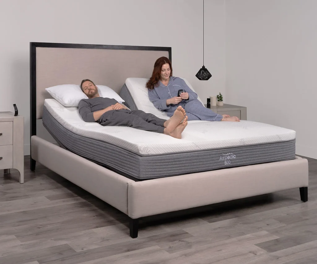 Airpedic adjustable mattress with woman relaxing in minimalist bedroom setting