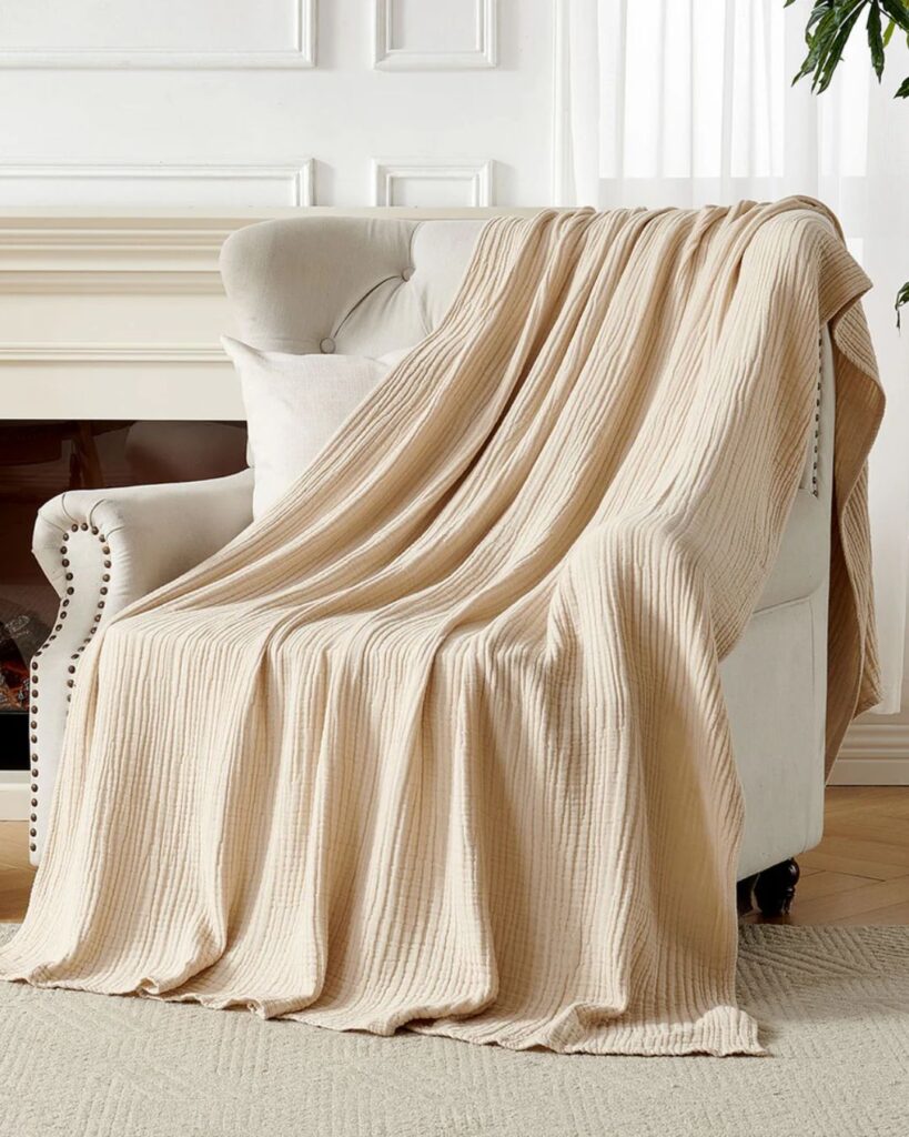 Joydeco soft throw blanket draped over accent chair for cozy home styling