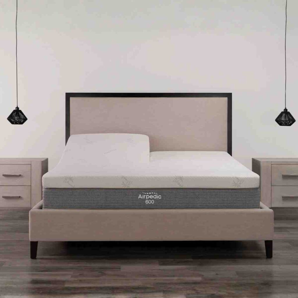 Close up of an Airpedic 600 mattress showing the premium quilted top and 6-chamber air support system in a minimalist room.