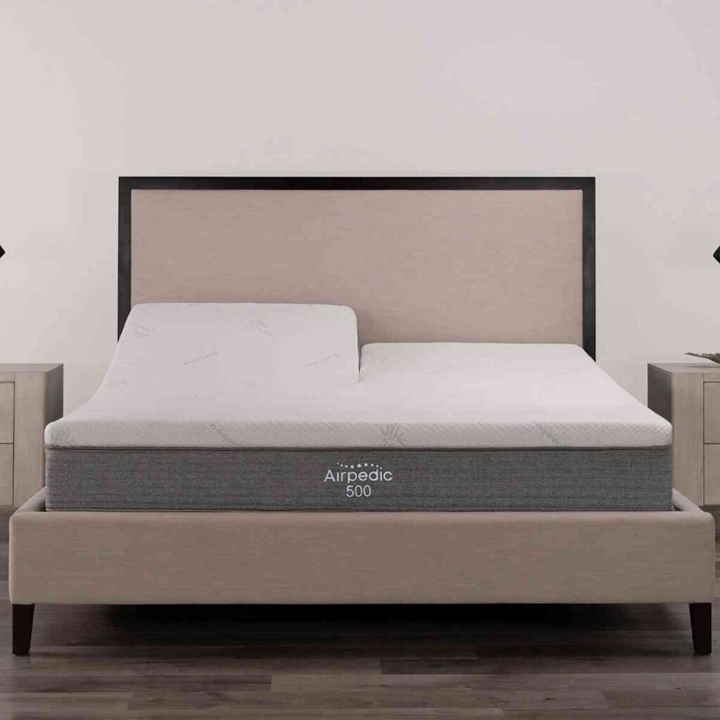An Airpedic adjustable air mattress with the head section tilted up in a luxury bedroom setting, highlighting the dual-zone comfort technology.