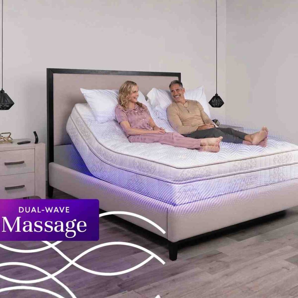Couple relaxing on an Airpedic Flex 300 Premier adjustable base in a zero-gravity position with built-in massage feature.