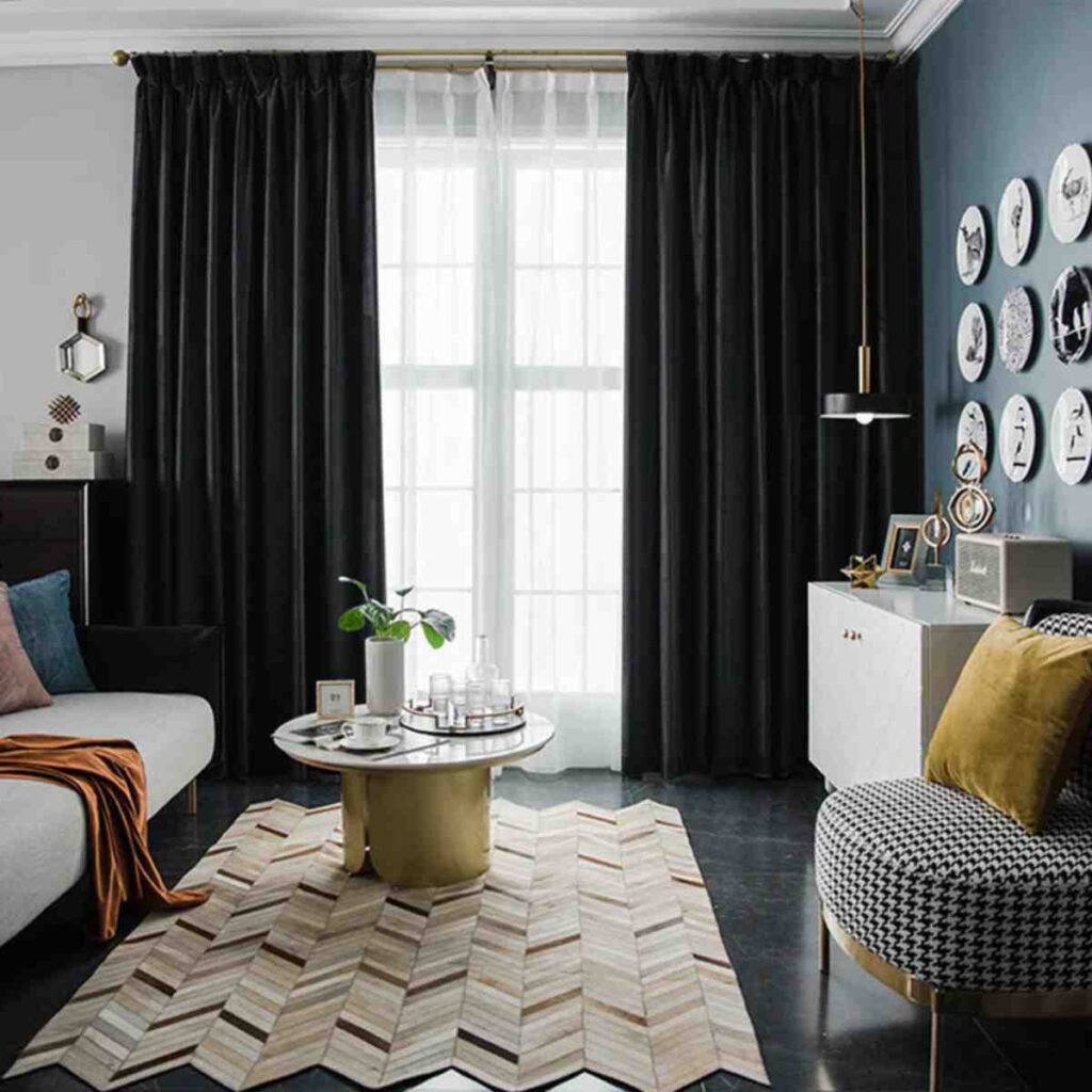 Rich antique green modern velvet curtains in a sophisticated dark-toned living room.