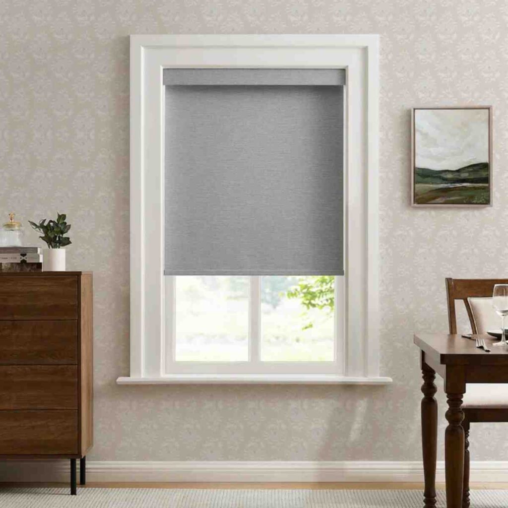 Custom white-gray linen look 100% blackout roller shade by CurtainUK in a modern window.