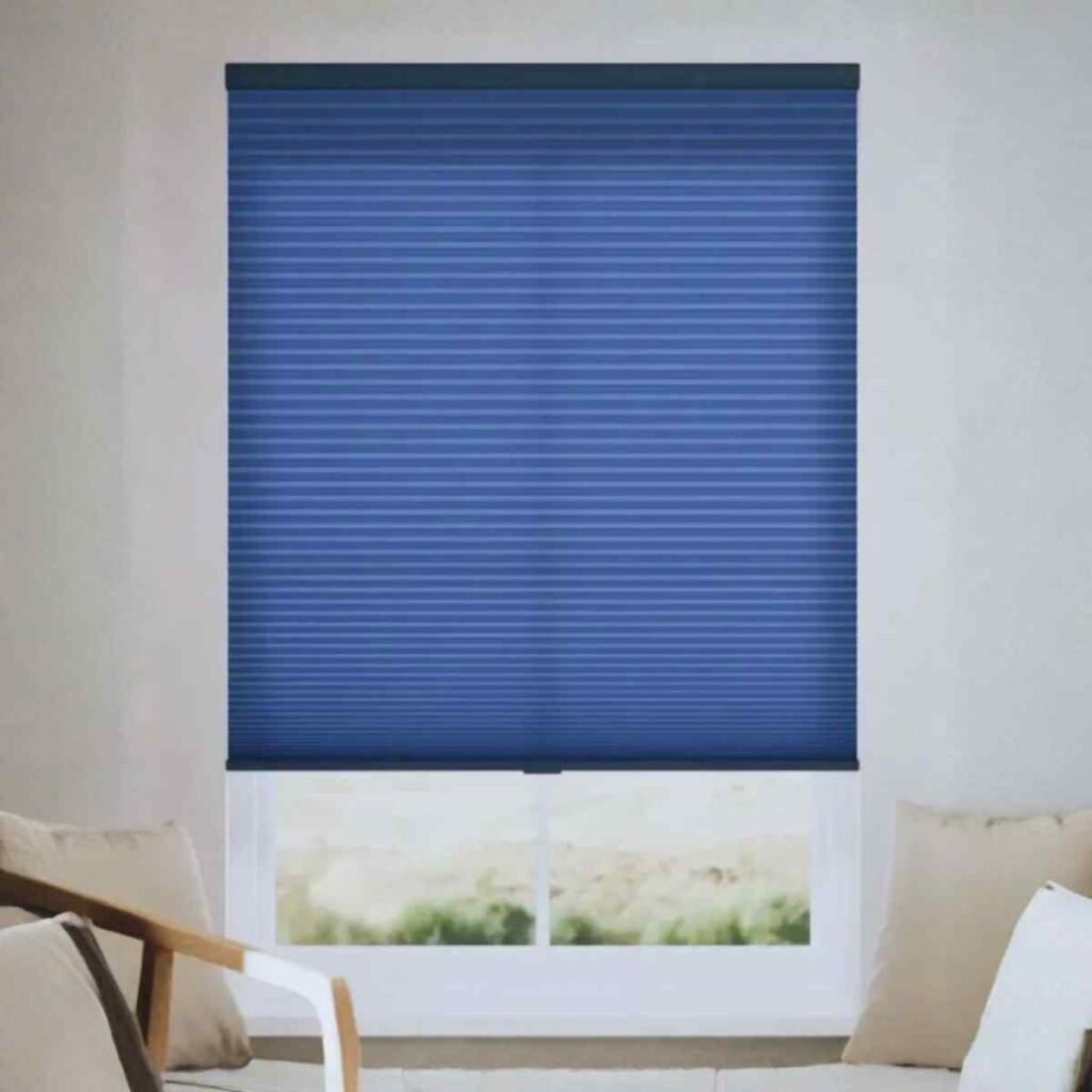 Navy blue energy-efficient cellular shades with honeycomb structure for maximum thermal insulation and privacy.