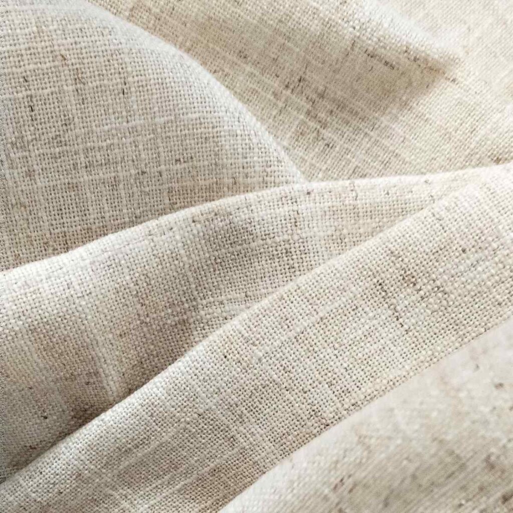 Close up of Joydeco sheer linen fabric showing the high-quality weave and texture.