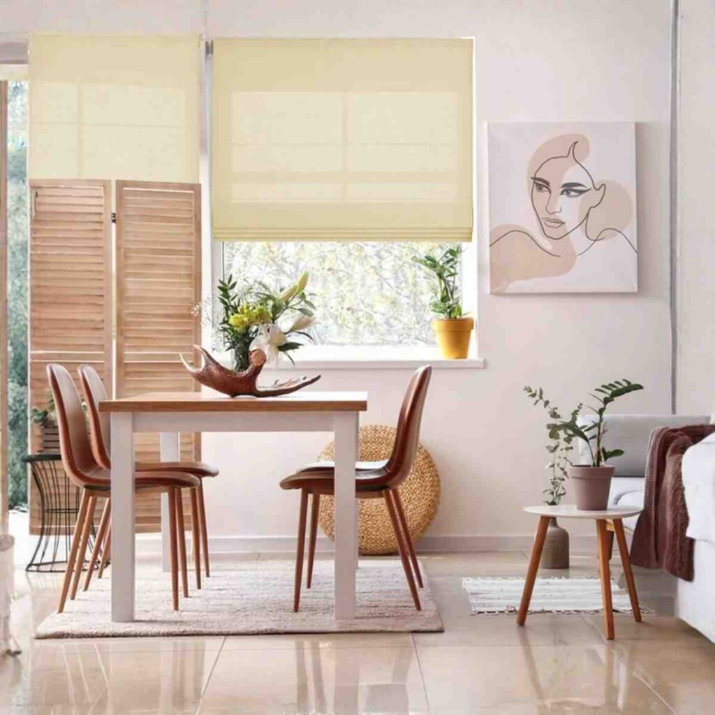 Joydeco custom light-filtering Roman shade in a creamy linen fabric over a dining room window.