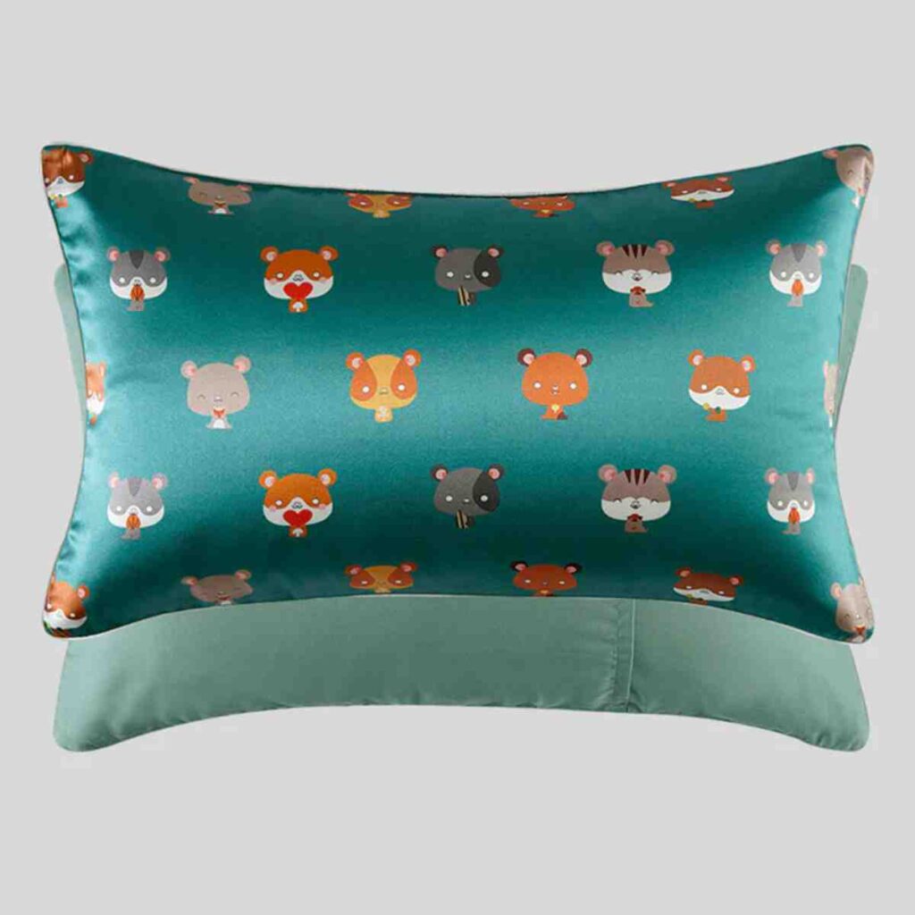 Teal silk pillowcase featuring cute fox and owl animal illustrations.