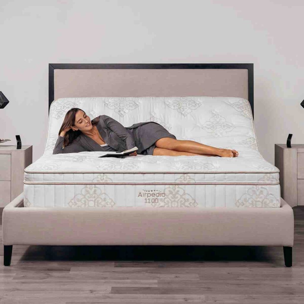 Woman in a lounge position on a RestFlex 200 adjustable ergonomic base.