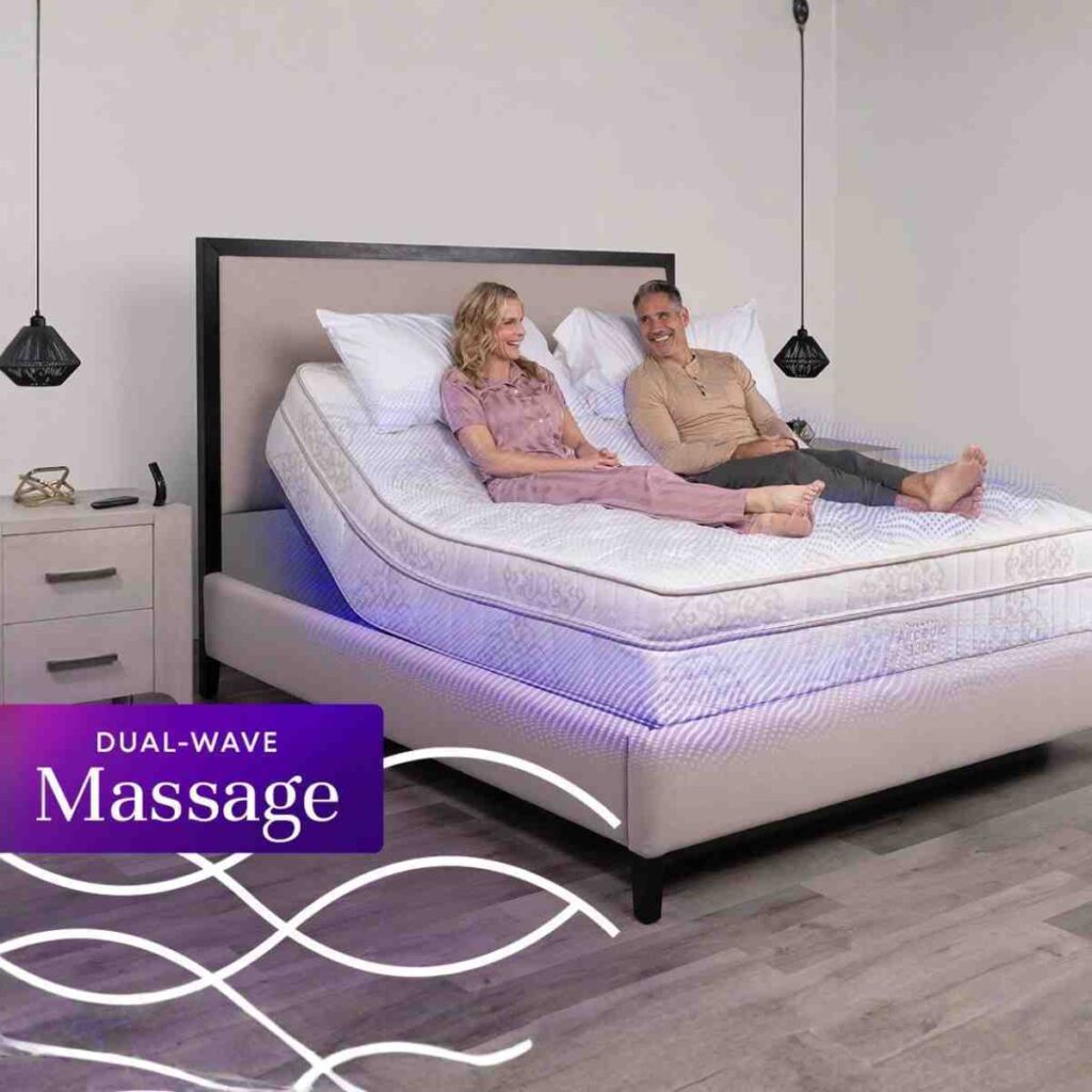 Couple on a RestFlex 300 bed with a graphic indicating the massage feature.