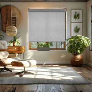Joydeco grey sheer weave motorized solar shades in a bright, modern living room featuring a mid-century lounge chair and lush green plants.