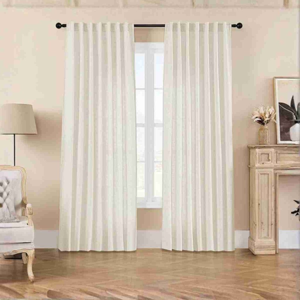 Explore Joydeco Ivory Linen Curtains Joydeco Ivory on Linen Flaxaline Curtains in a bright, coastal room.