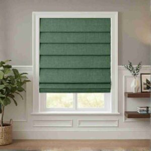 Sophisticated sage green cordless roman shades with a textured linen-like finish installed on a white window frame in a bright modern room.