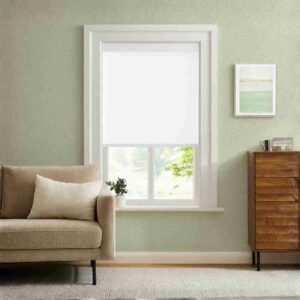 Elegant white linen blackout roller shades installed in a modern sage green living room, featuring a sleek cordless design and textured finish.