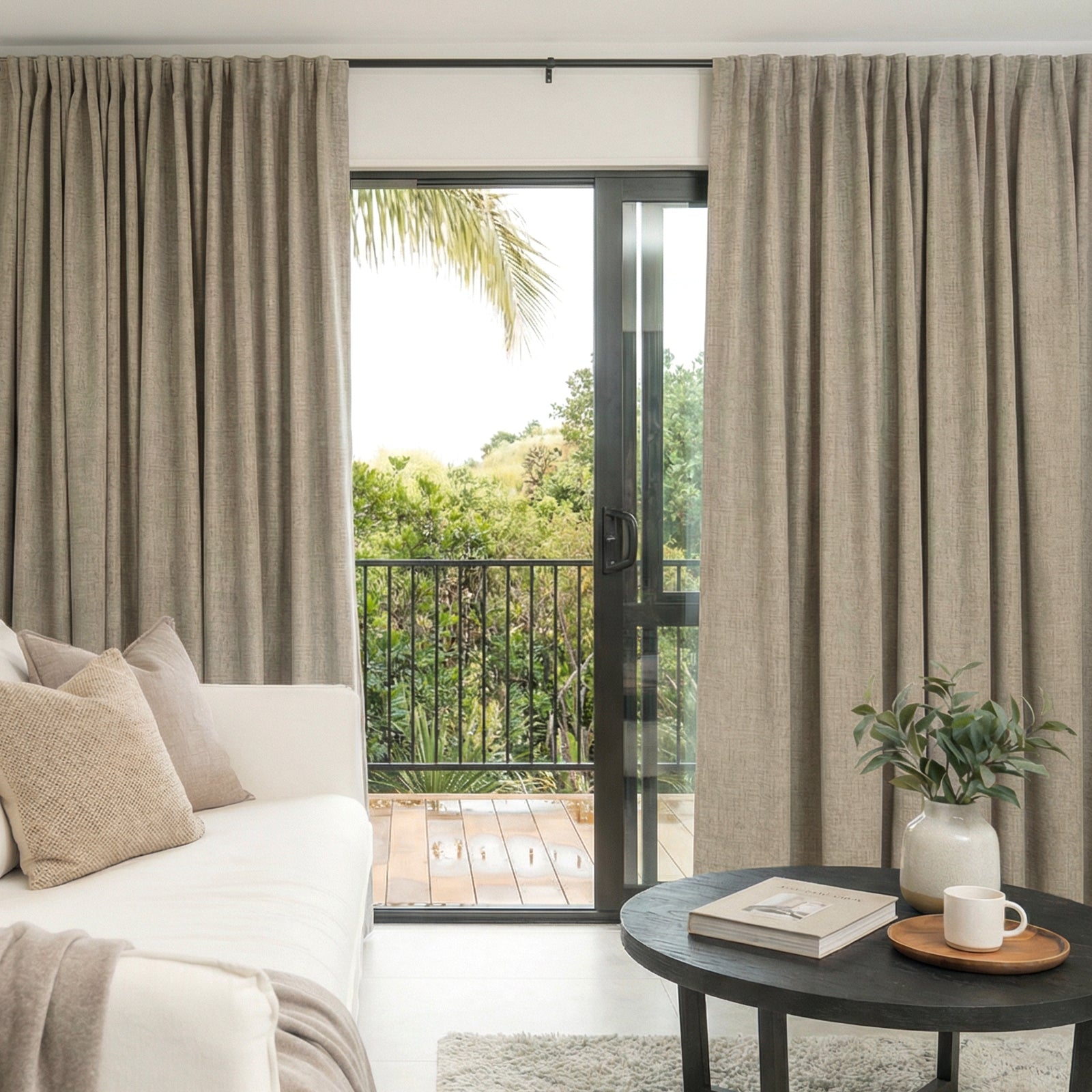 Alder 100% Blackout Linen Look Curtain - Linen 1 A polished residential space styled beautifully with a high-quality alder linen blackout curtain filtering daylight.