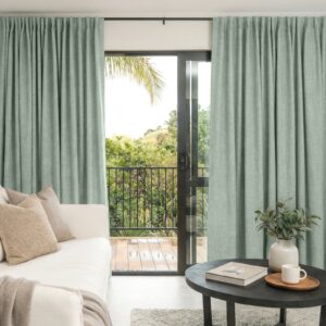 Polished contemporary floor space highlighting a gorgeous alder sage green curtain running along a high-traffic hallway entryway.