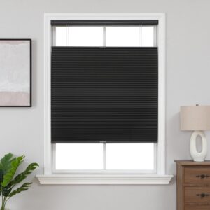 A modern well-appointed residential space showcasing functional black top down cellular installed cleanly over a window frame.