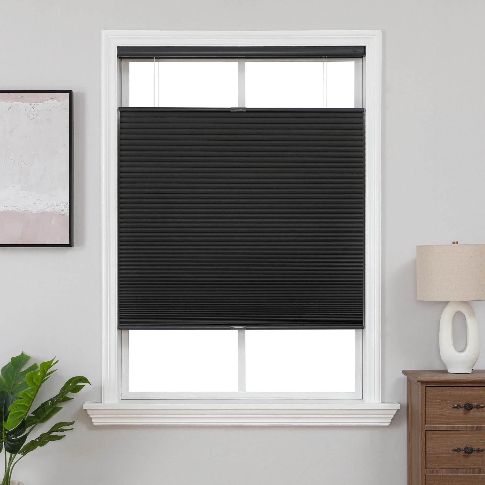 Custom No-Drill Cordless Blackout Cellular Honeycomb Shades, Top-Down Bottom-Up - Black 1 A modern well-appointed residential space showcasing functional black top down cellular installed cleanly over a window frame.