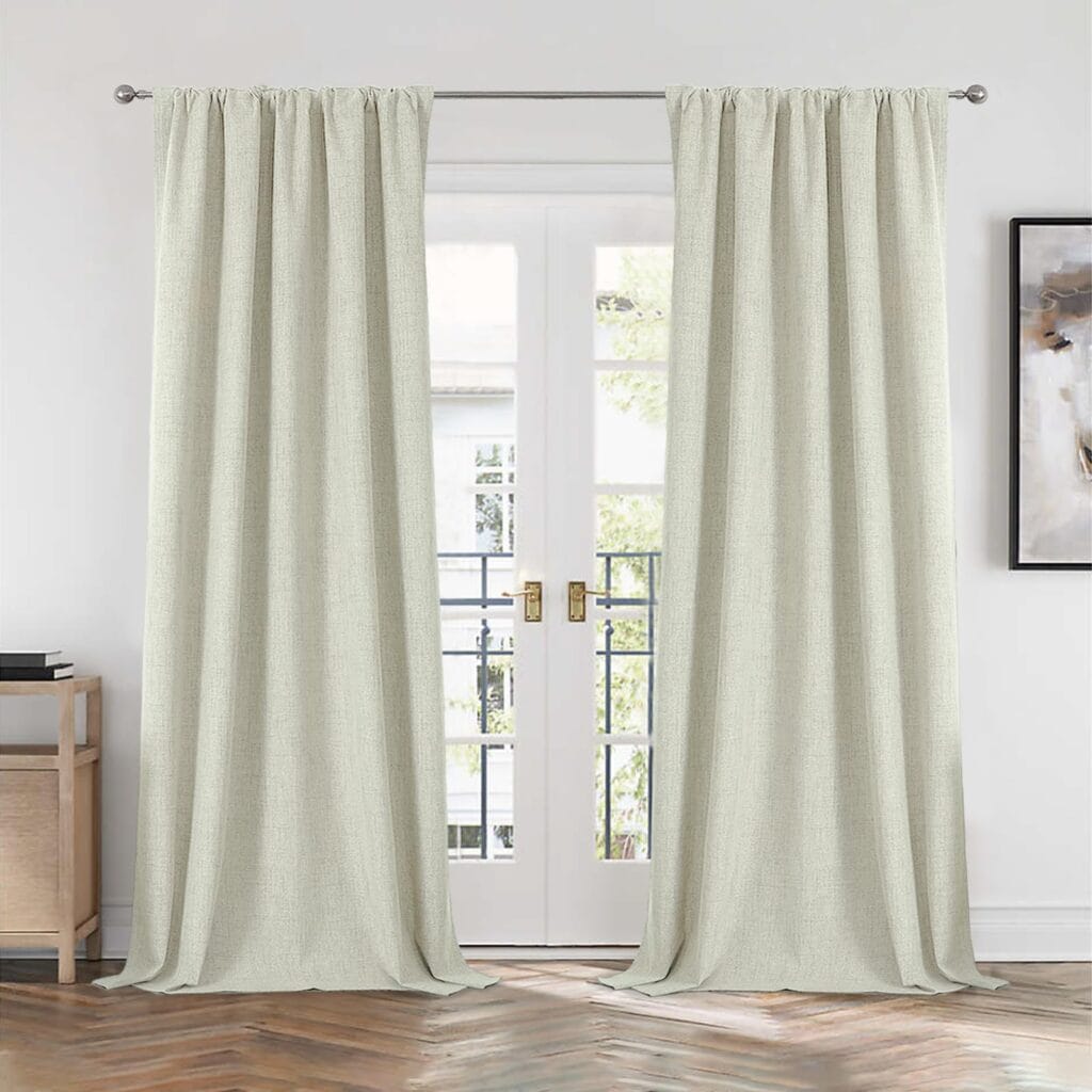 Clean interior visual presentation showing how light beige linen curtains seamlessly dress a living room layout.