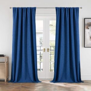 Clean interior visual presentation showing how navy blue blackout curtains seamlessly dress a living room layout.