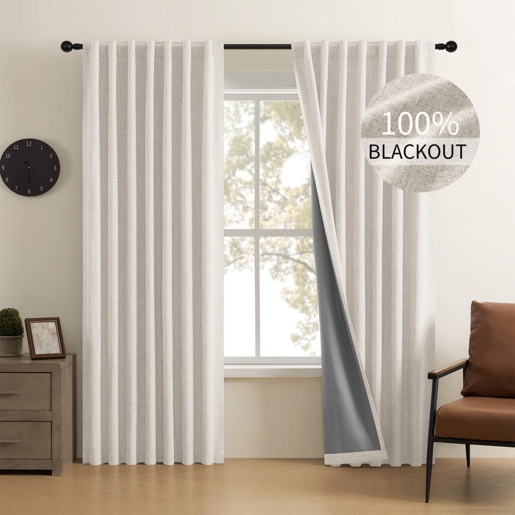 Elegant drapery style exhibition accenting the heavy texture of off white blackout curtains near a cozy corner.