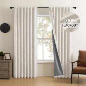 Elegant drapery style exhibition accenting the heavy texture of off white blackout curtains near a cozy corner.