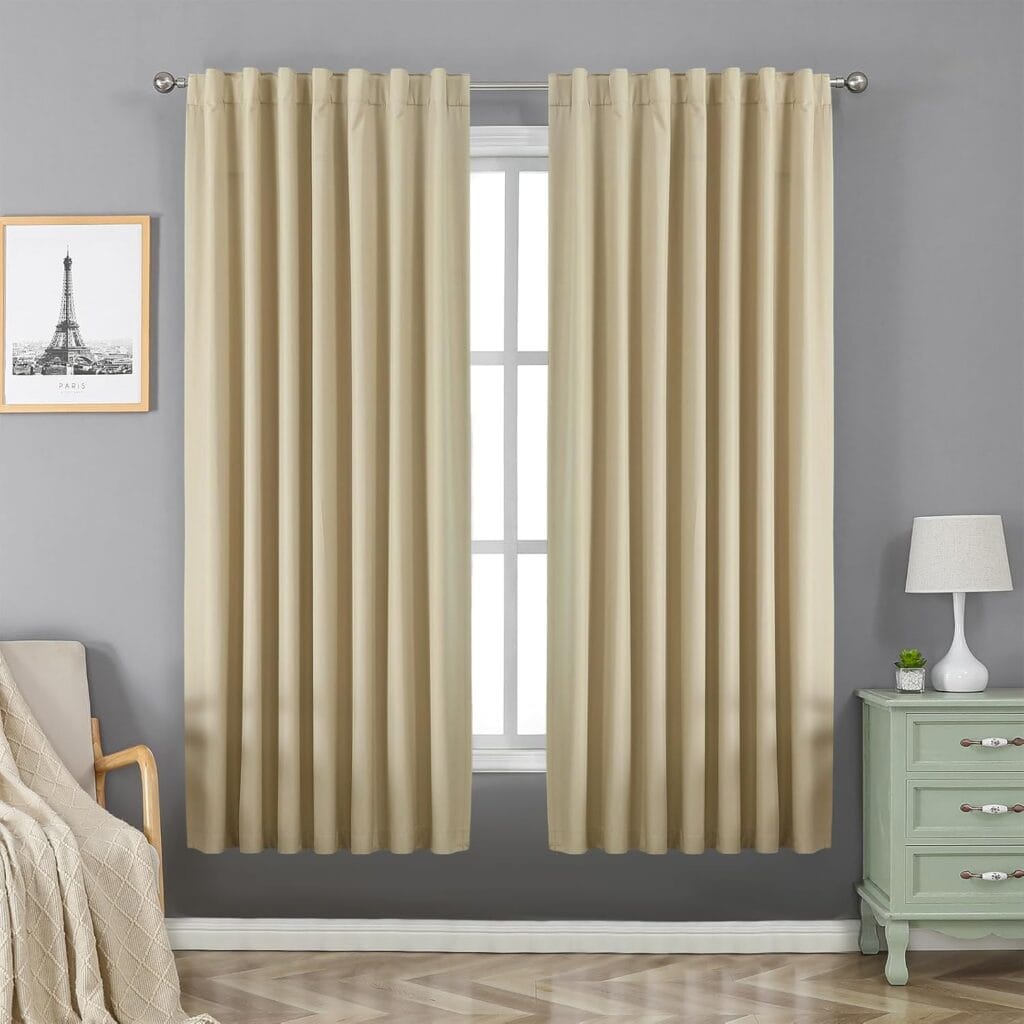 Nicely decorated event space or residential photography corner utilizing a premium set of beige back tab curtains.