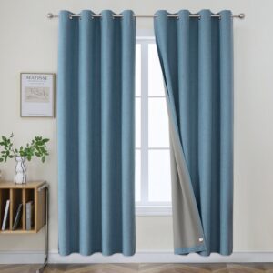 A close up look at premium blackout linen light blue set up elegantly in a sunny master bedroom.