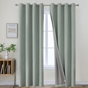 Elegant textured look of Joydeco 100% sun-blocking blackout linen sage green panels for a luxurious bedroom.