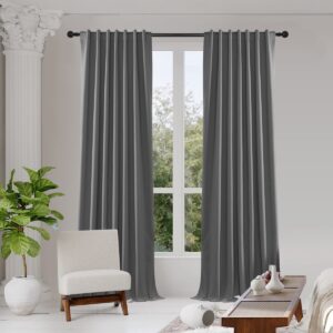 A modern home interior showing high-quality linen curtains dark grey installed clean across a bright window frame.
