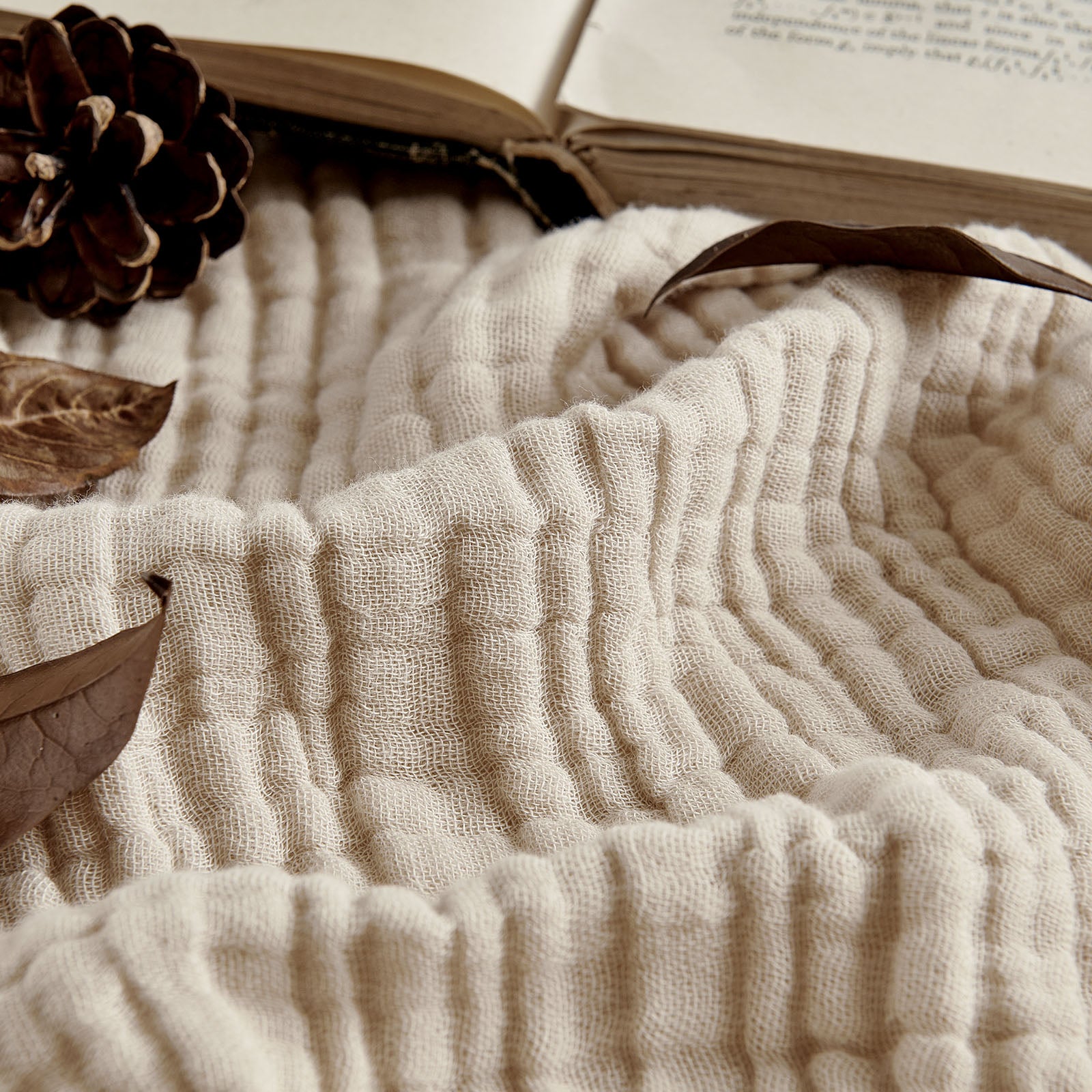 Joydeco 100% Cotton Muslin 4-Layer Breathable Throw Blanket - Light Tan 1 Polished interior window frame displaying how a customized breathable blanket light tan limits direct afternoon solar reflections.