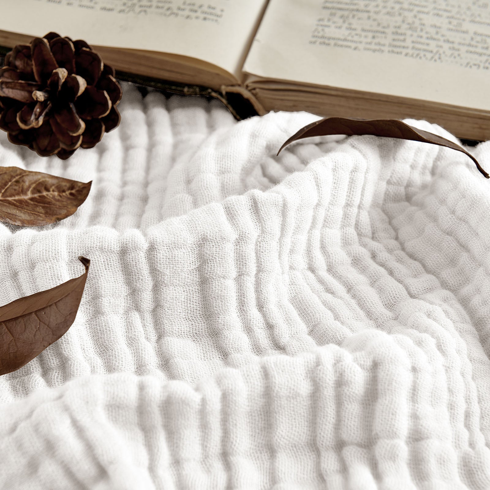 Joydeco 100% Cotton Muslin 4-Layer Breathable Throw Blanket - White 1 Sleek architectural setup showcasing a functional breathable throw blanket white shielding a bright room to optimize screen visibility.