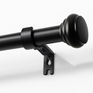 Close-up macro view focusing on the fine hardware craftsmanship and smooth metallic profile of a durable black heavy duty curtain rod.