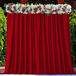 Close-up macro shot focusing on the high-quality fabric grain and neat stitching details of a durable red backdrop curtains set.