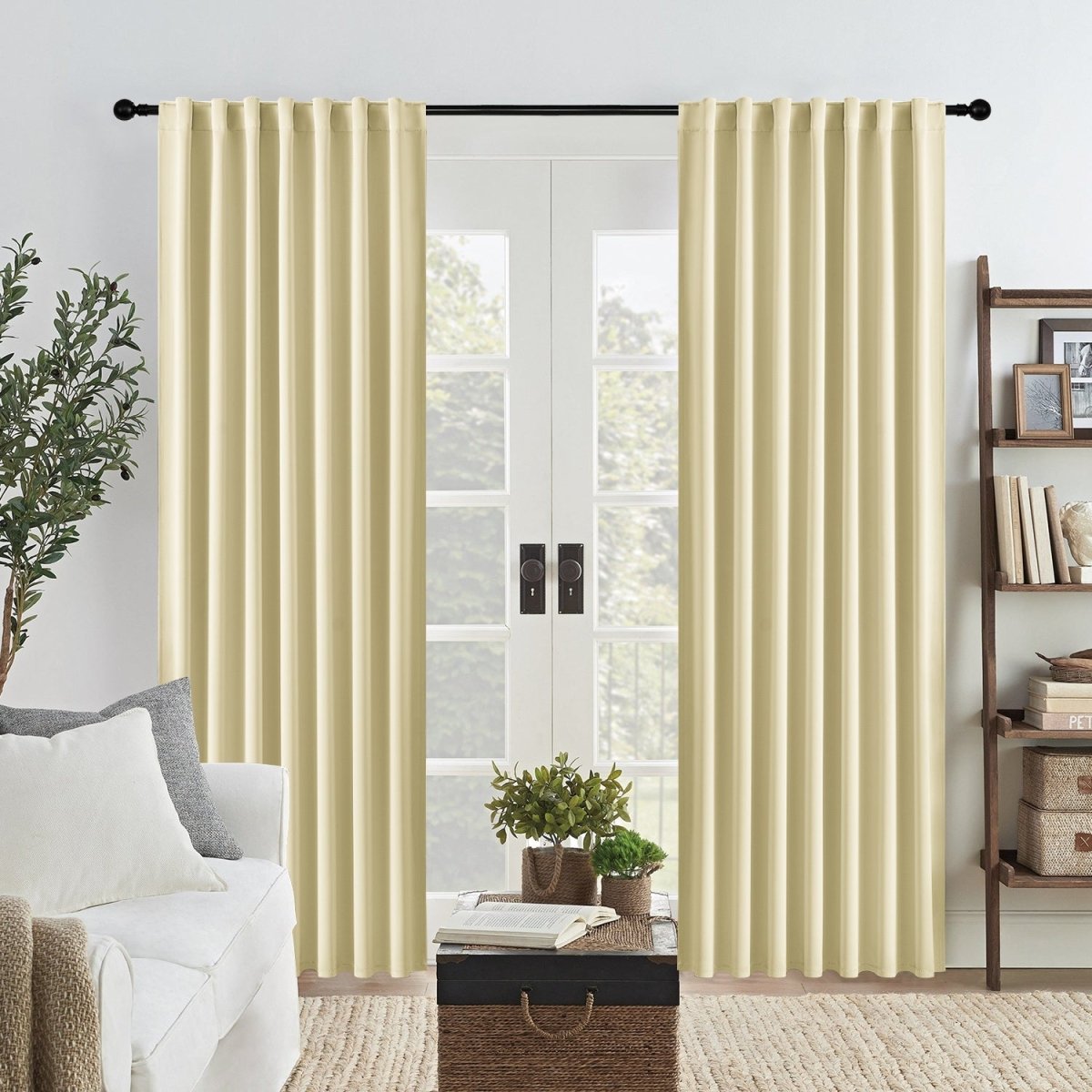 Joydeco Blackout Bedroom Curtains, 2-Panel Set - Light Beige 1 Beautifully arranged apartment interior featuring the clean straight hang of a premium blackout curtains light beige set.