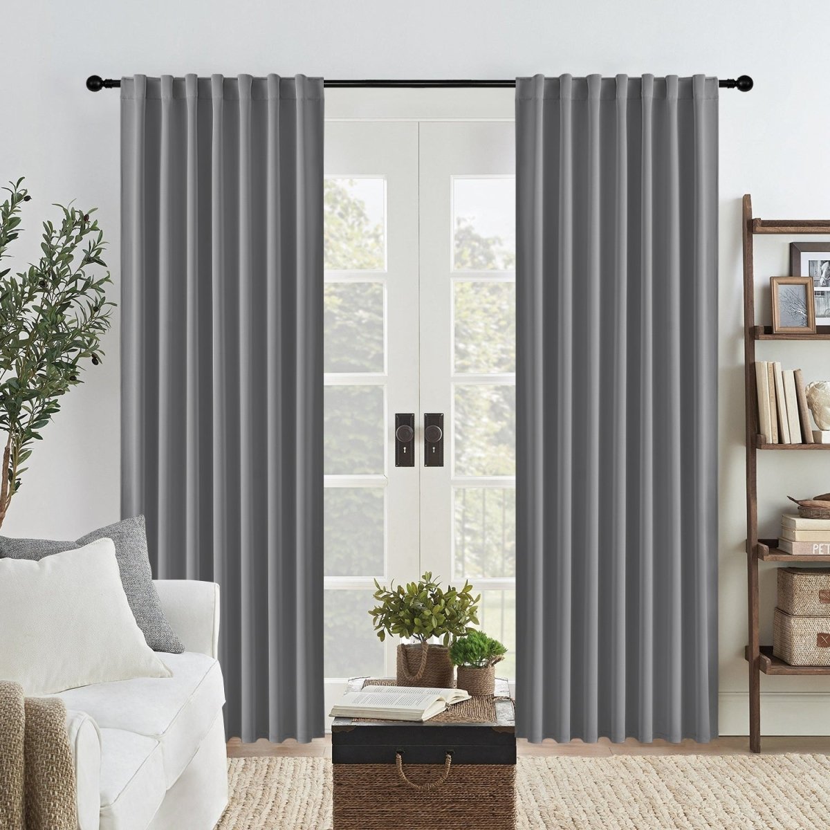 Joydeco Blackout Bedroom Curtains, 2-Panel Set - Light Grey 1 A peaceful master suite window setting showcasing high-quality blackout curtains light grey drawn neatly together.