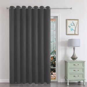 Polished living room setup showing how a set of integrated grey door divider curtain provides excellent sun glare coverage.