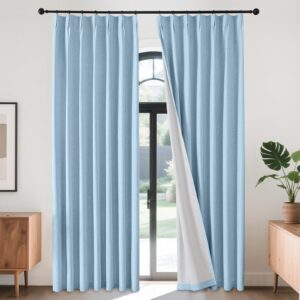 Sleek architectural setup showcasing the smooth horizontal profiles of an integrated chambray blue linen curtains setup.