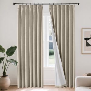 A peaceful master suite residential bedroom layout featuring premium cobblestone linen curtains hung clean by a sunny window frame.