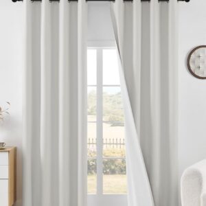 Close-up macro shot focusing on the high-quality fabric grain and neat stitching details of a durable ivory blackout curtains set.