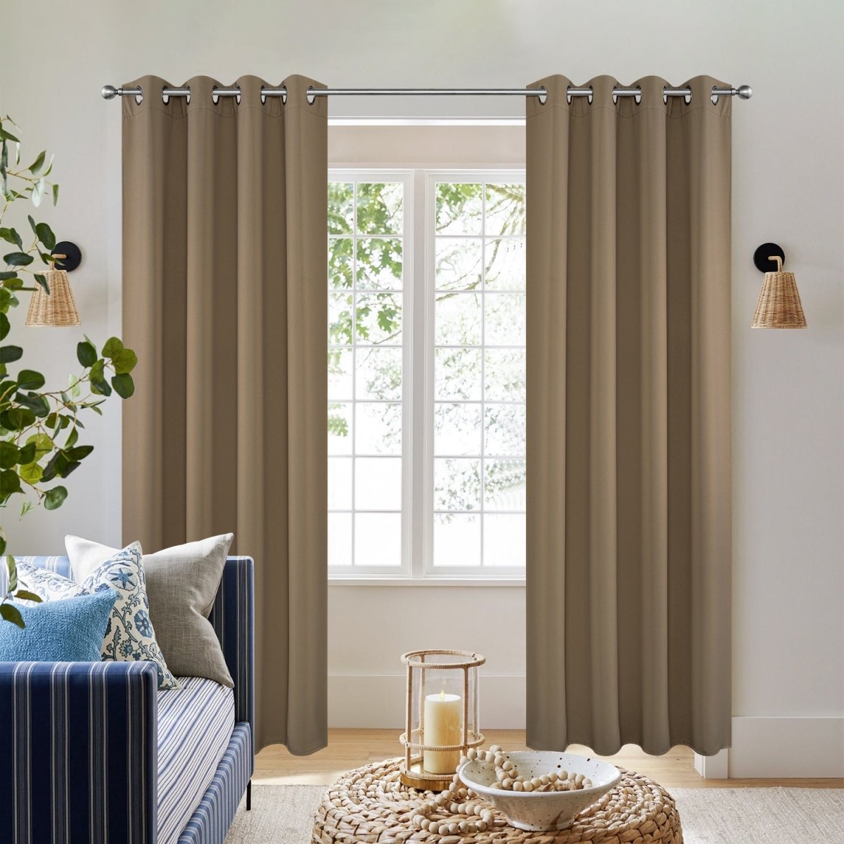 Joydeco Blackout Thermal Insulated Long Curtains, 2-Panel Set - Khaki 1 Stylish joydeco blackout khaki sun-blocking drapes hanging gracefully next to a decorated side table.