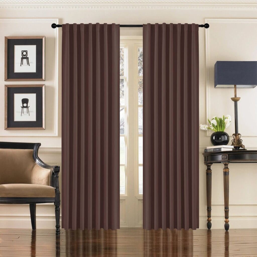 Beautifully arranged apartment interior featuring the clean straight hang of a premium thermal curtains chocolate set.