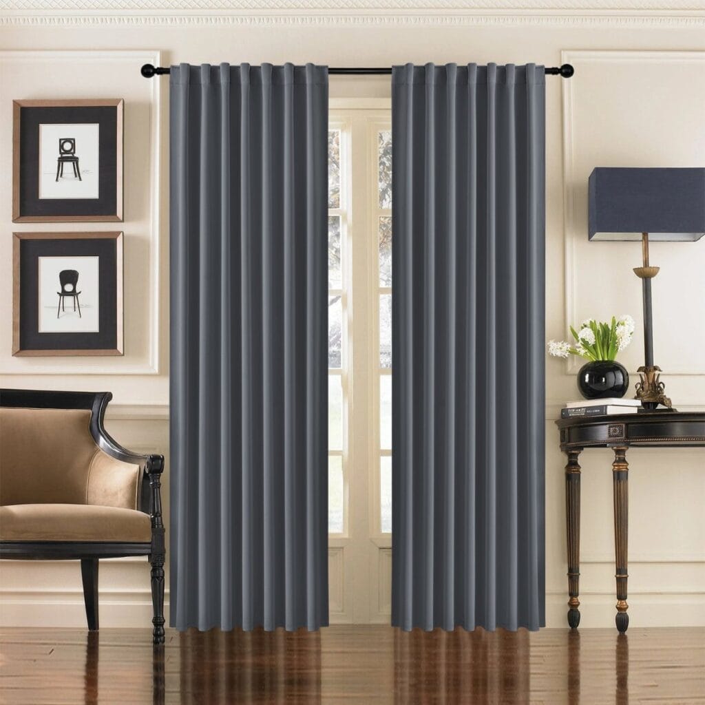 A peaceful master suite window setting showcasing high-quality thermal curtains dark grey drawn neatly together.