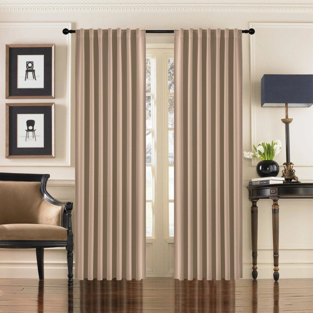 A peaceful master suite window setting showcasing high-quality thermal curtains beige drawn neatly together.