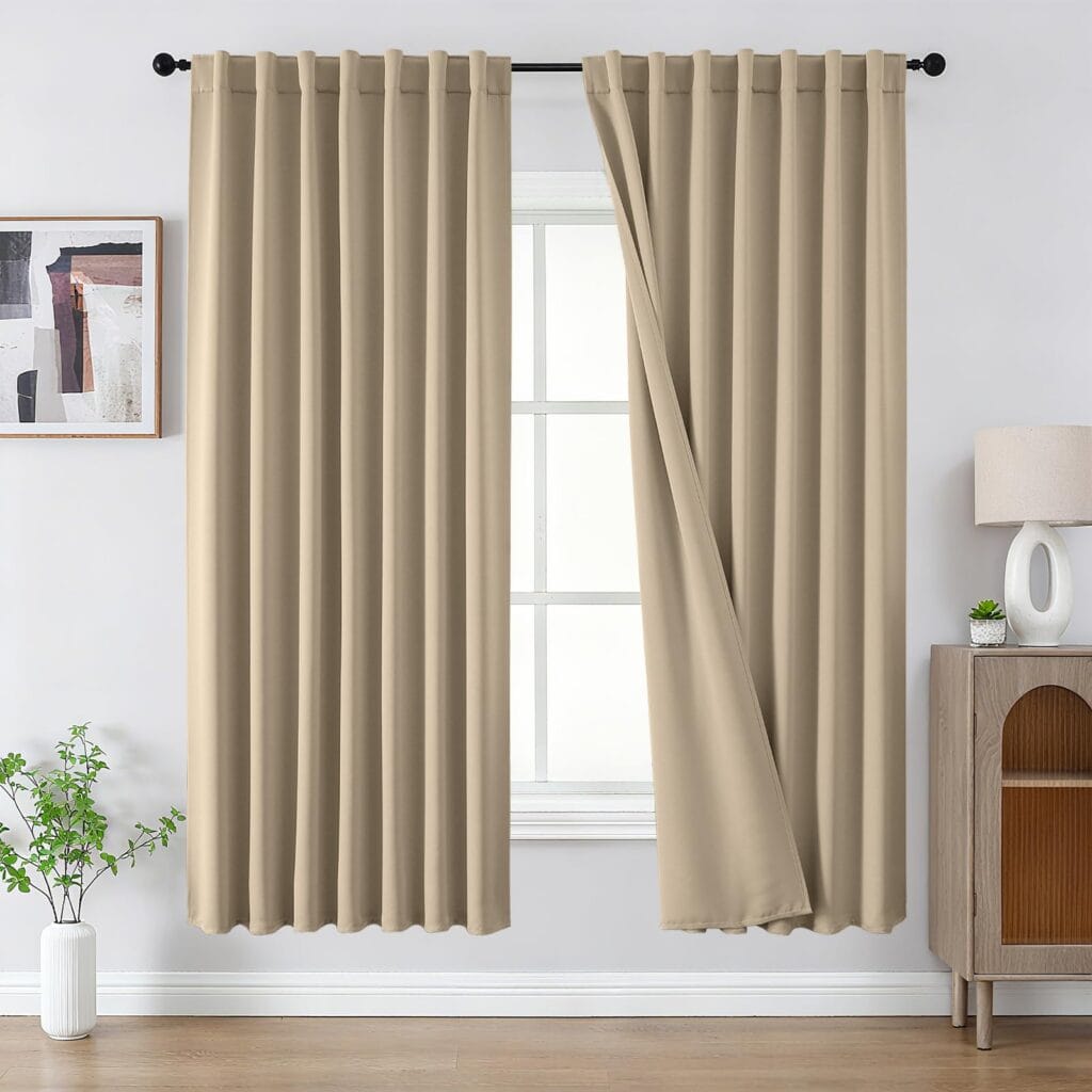 A peaceful master suite window setting showcasing high-quality thermal curtains light beige drawn neatly together.