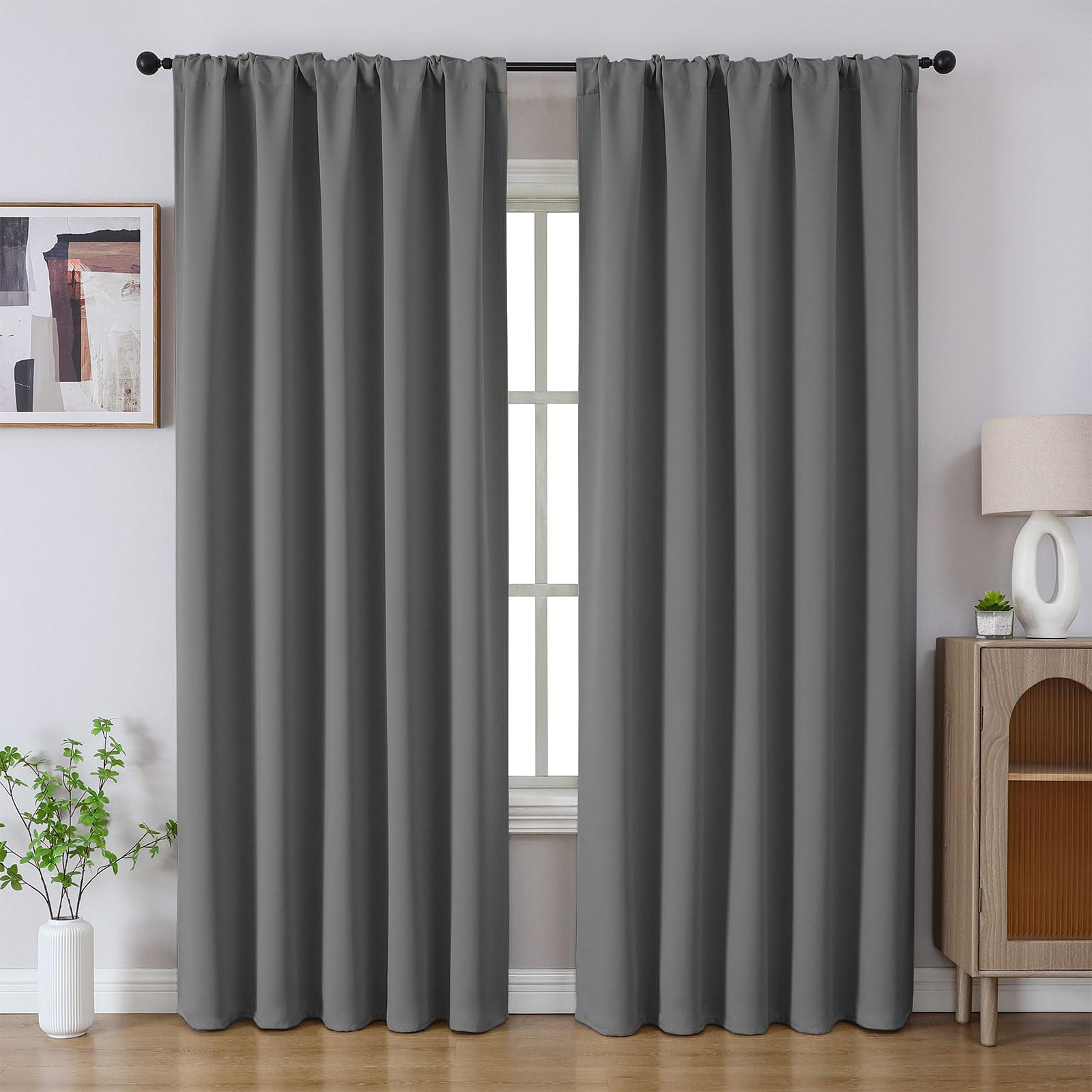 Joydeco Blackout Thermal Insulated Room Darkening Curtains for Bedroom & Living Room - Light Grey 1 Sleek residential window frame showing how an integrated pair of thermal curtain light grey blocks street glare perfectly.