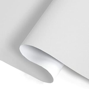 A close up look at premium cordless blackout ivory white set up elegantly in a sunny master bedroom.